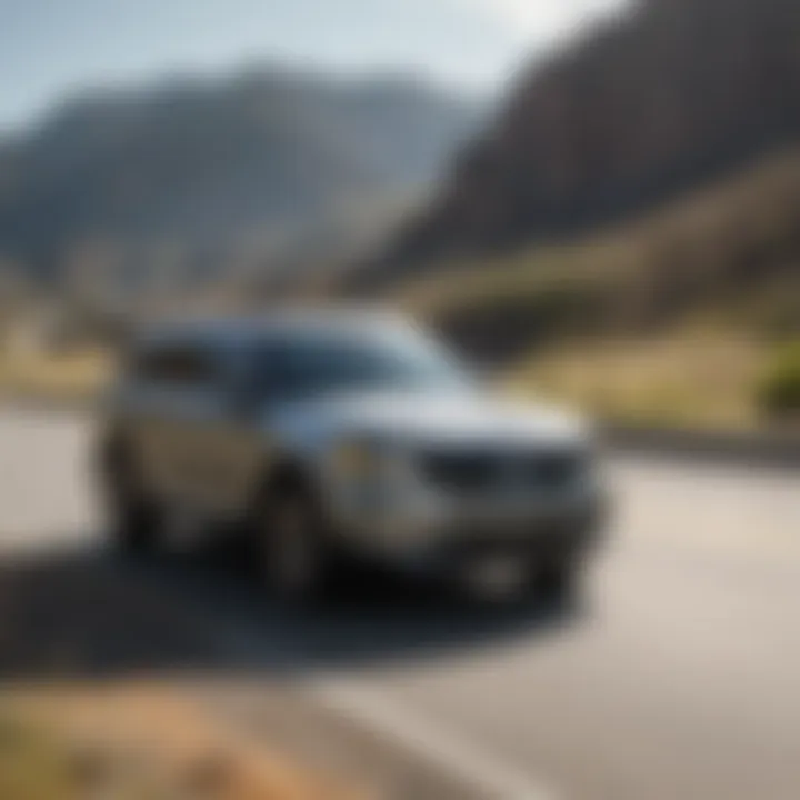 Kia Telluride on a highway with Utah mountains in the background