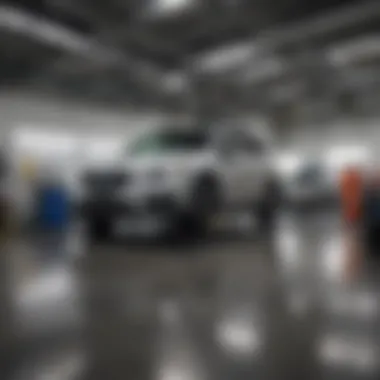 Service area showing technicians working on a Subaru vehicle.