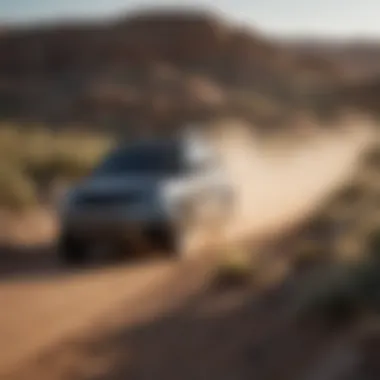 Landscape shot of a Land Rover driving through Wichita terrain