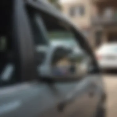 A side view mirror being carefully reattached to a vehicle with adhesive